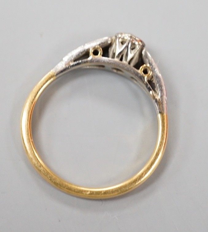 A yellow and white metal set solitaire diamond ring, size M, gross weight 3 grams.